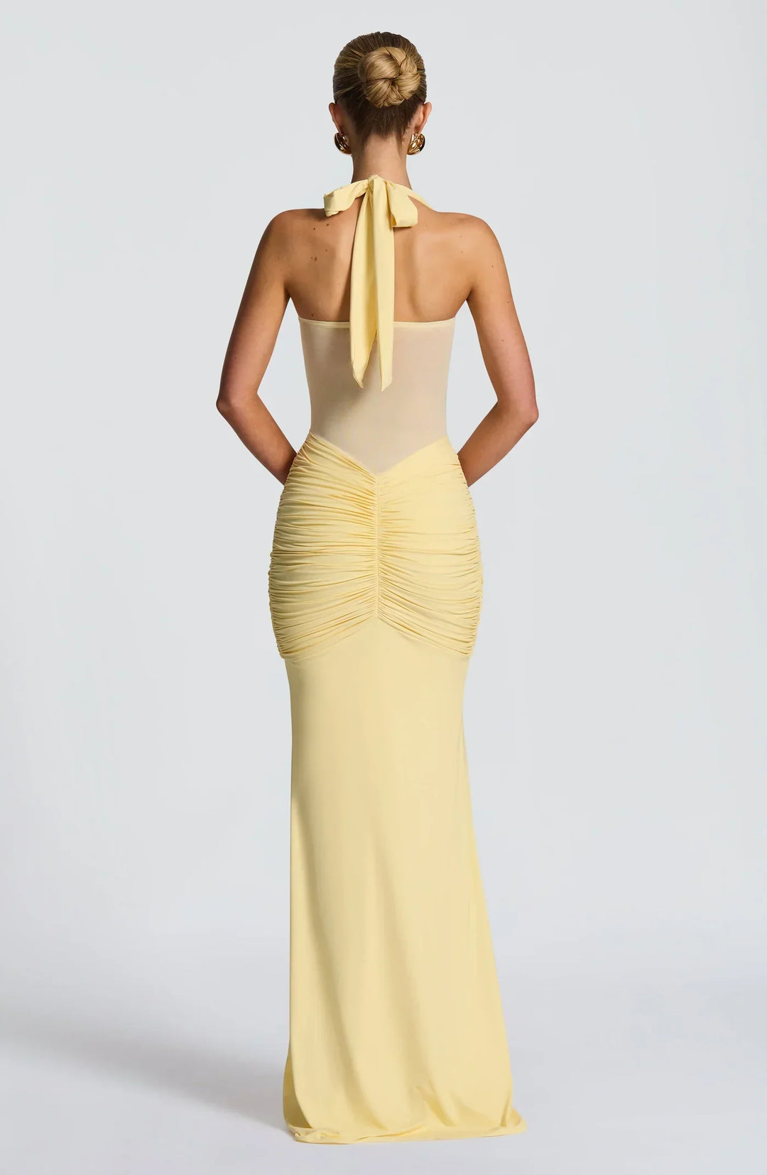 Fitted women's formal maxi dress showcasing an elegant hourglass silhouette for evening wear.