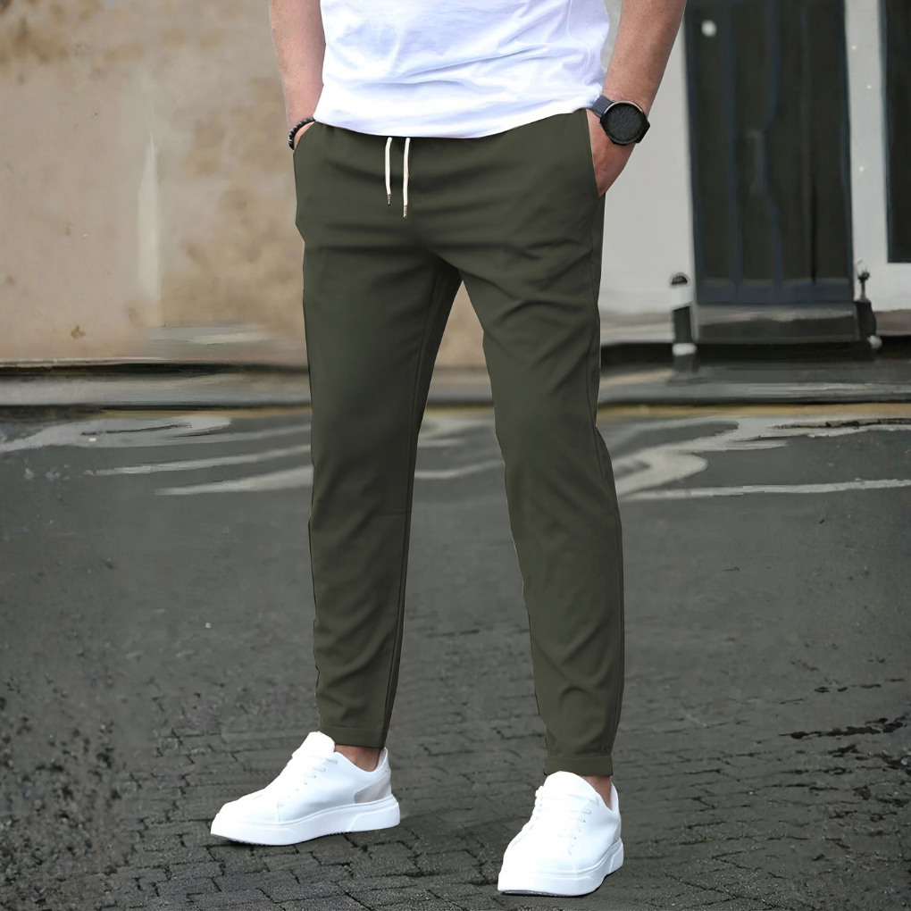 Comfortable men's slim fit drawstring travel pants, great for gym wear, casual style, and all-season use.