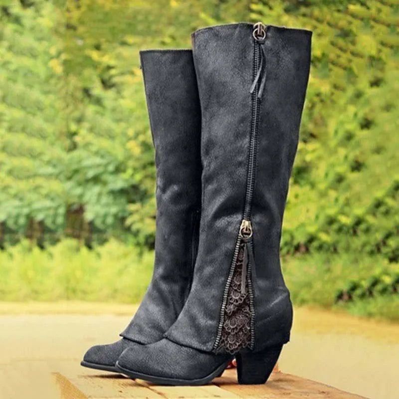 Classic women's knee-high boots with a comfortable block heel, featuring side zip & elegant lace details for winter style.