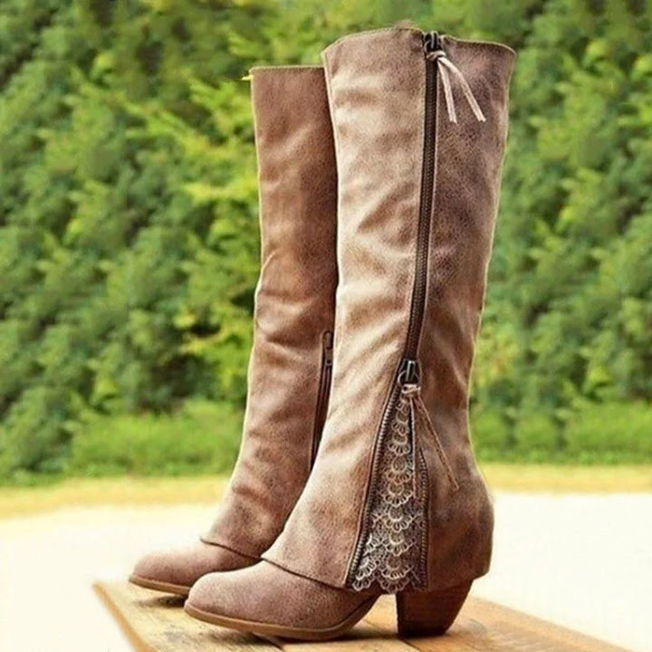 Elegant women's knee-high boots with stylish side zip and delicate lace detail, perfect for autumn fashion.