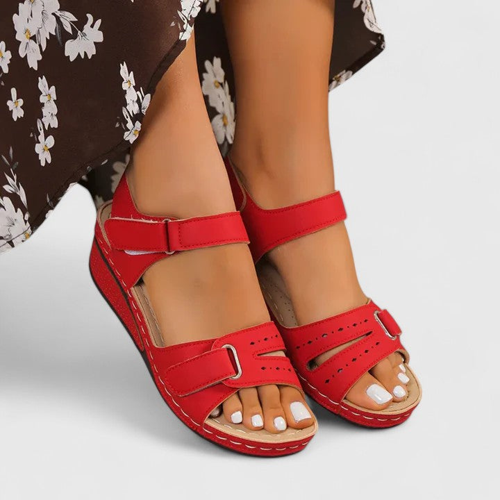 Women's orthopaedic sandals with arch support, adjustable straps, and comfort design for daily wear.