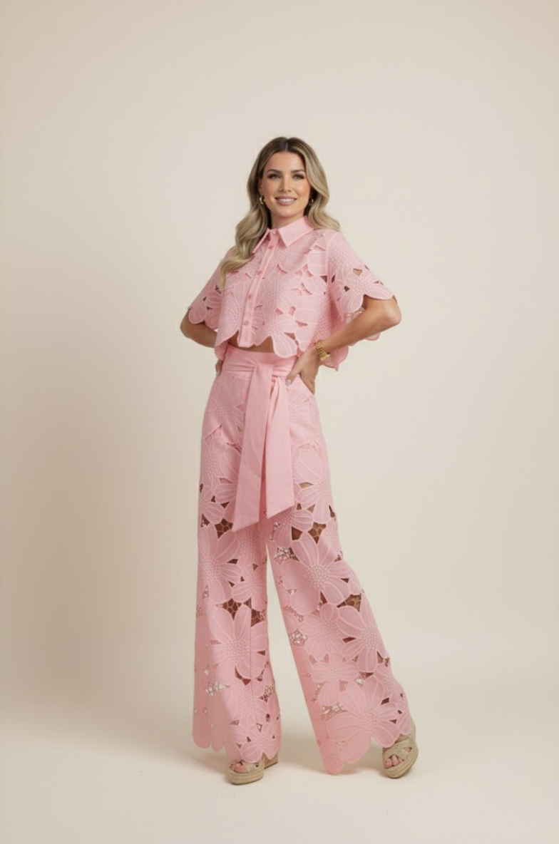 Women's fashion two-piece set with delicate floral embroidery and flowy wide-leg pants.