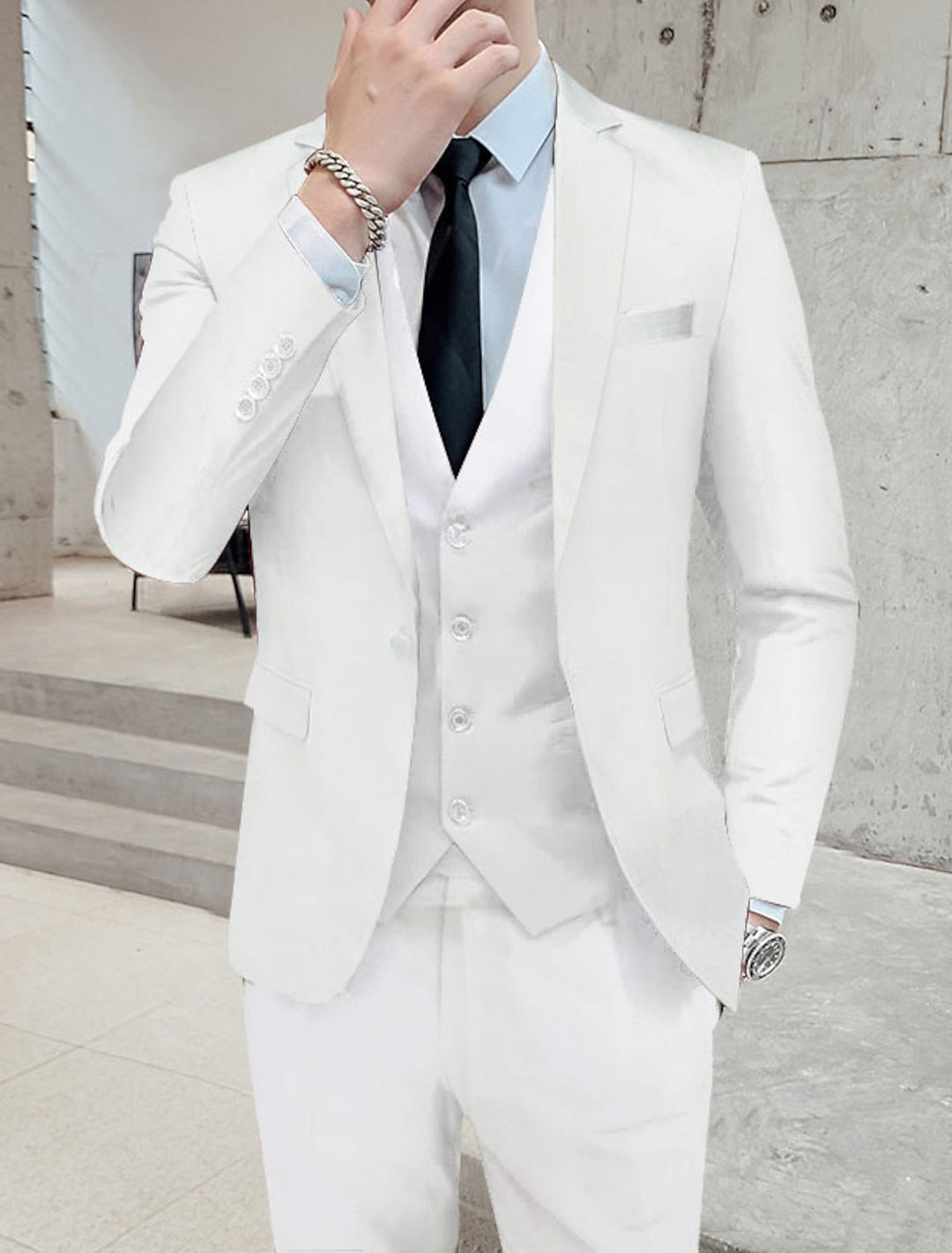 Sophisticated men's formal wear: a single-breasted 3-piece suit, perfect for special occasions & business.