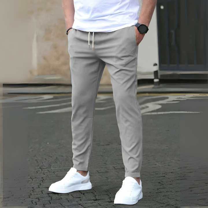 Men's slim fit pants with adjustable drawstring, offering sleek modern style, comfort, and versatility for daily wear.