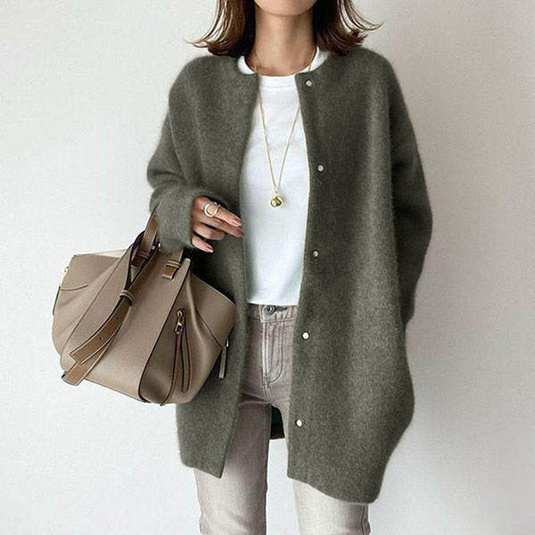 Women's longline button cardigan, a perfect minimalist layering piece for versatile autumn and everyday fashion.