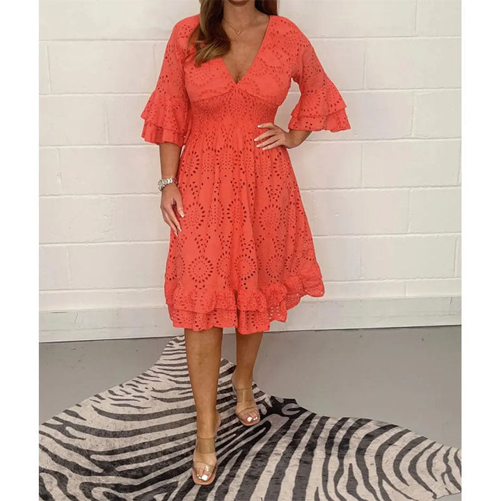 Women's elegant midi dress with exquisite embroidery details, embodying a romantic and timeless summer style.