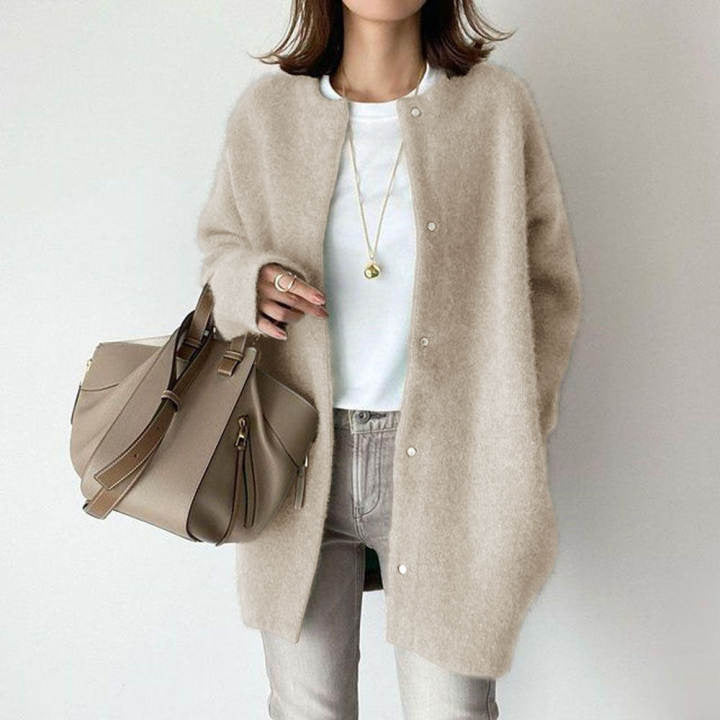 Graceful women's minimalist longline button cardigan, designed for comfortable chic style and effortless layering.