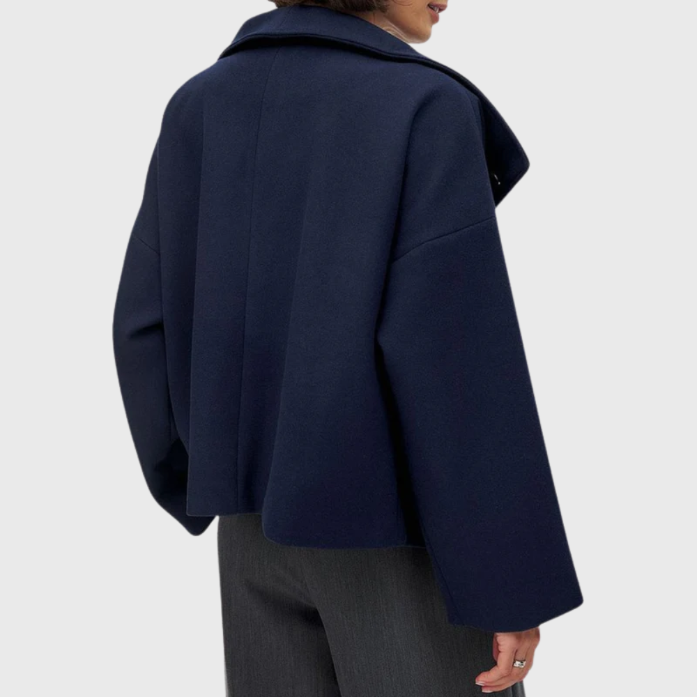 Versatile women's cropped double-breasted coat. Wide lapel detail, ideal for modern fashion.