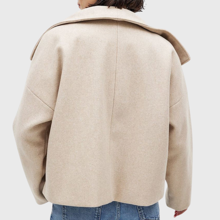 Women's fashion cropped double-breasted coat with elegant wide lapels. Chic outerwear apparel.