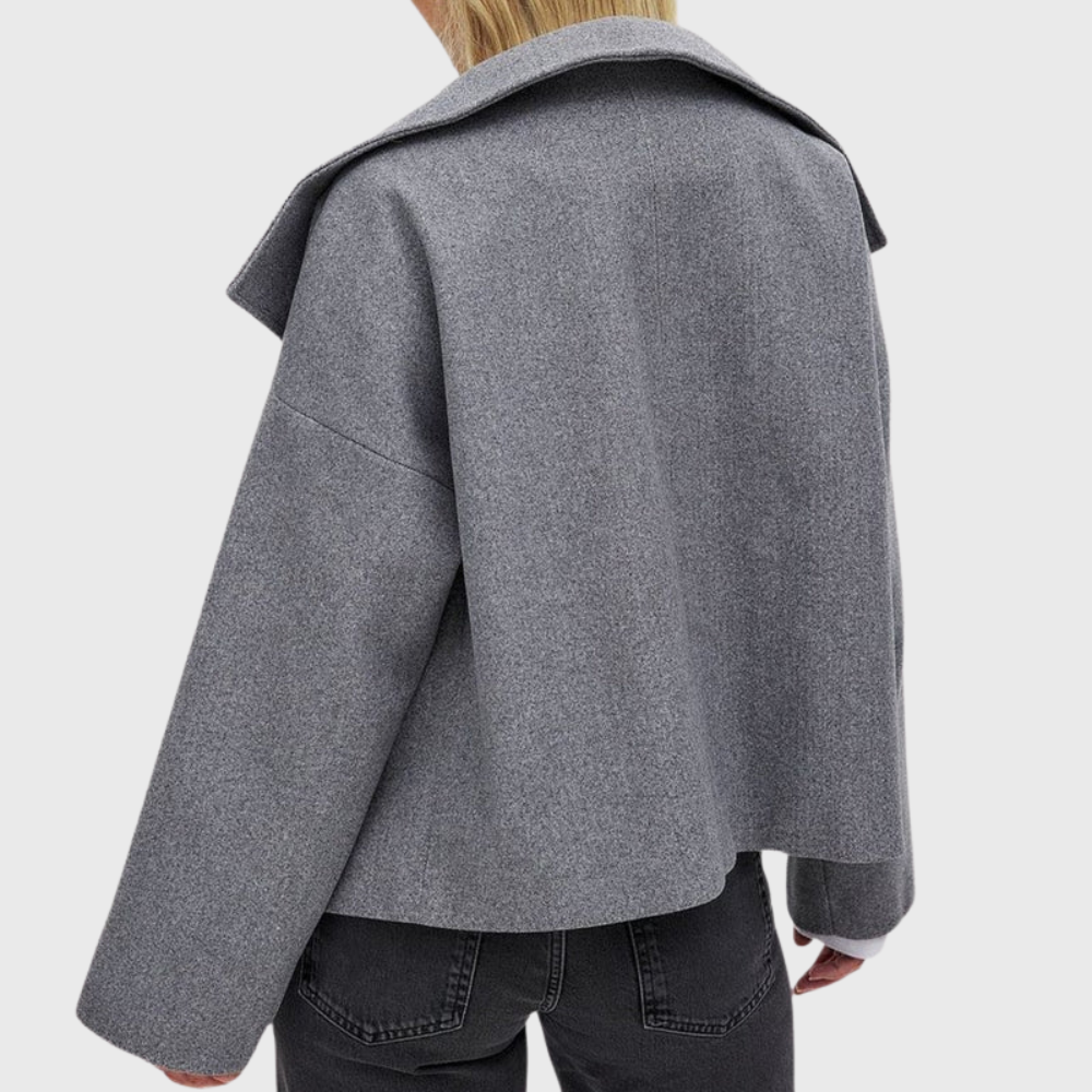 Trendy women's cropped double-breasted coat, wide lapel design. Modern statement jacket.