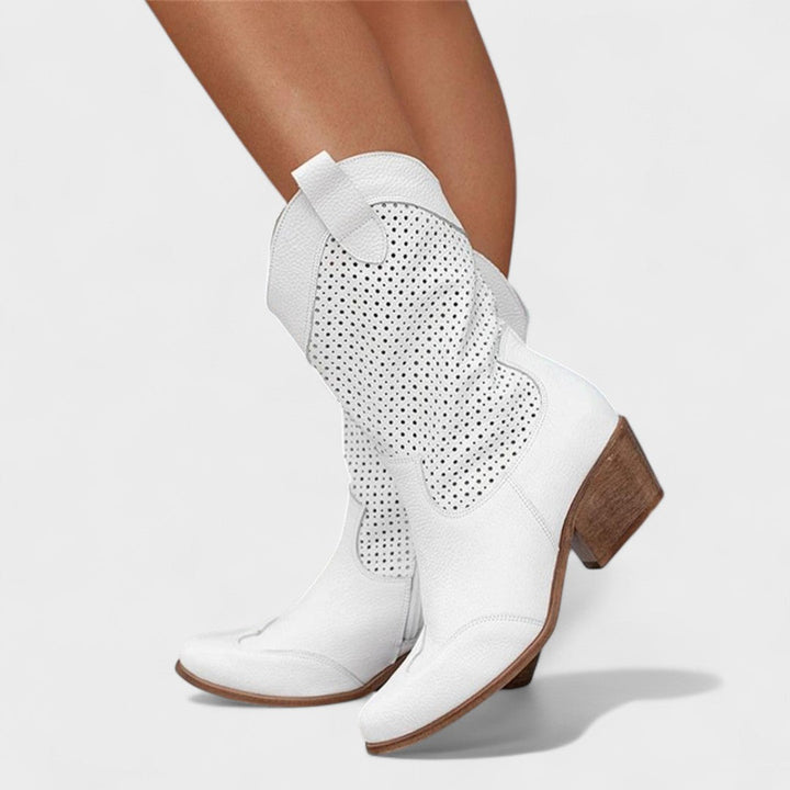 Comfortable women's mid-calf boots, stylish perforated design, stable block heel. Great for fall/winter fashion.