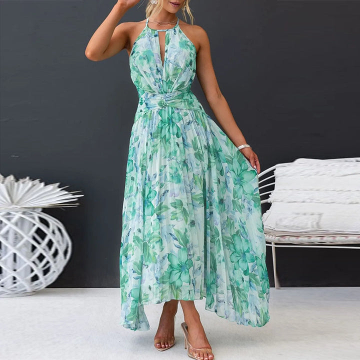 Women's elegant green floral halter maxi swing dress. Comfortable boho summer fashion, perfect for resorts.