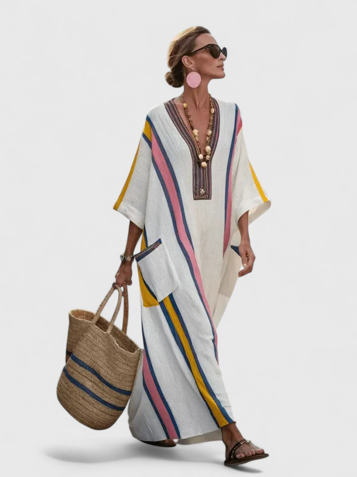 Striped V-neck maxi dress with kaftan style. Comfortable women's fashion sundress, ideal for resort wear.