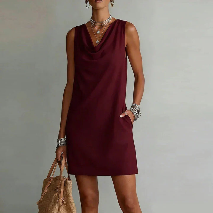 Casual women's mini dress with a stylish cowl neck and functional pockets. Relaxed A-line fit, great for weekend.