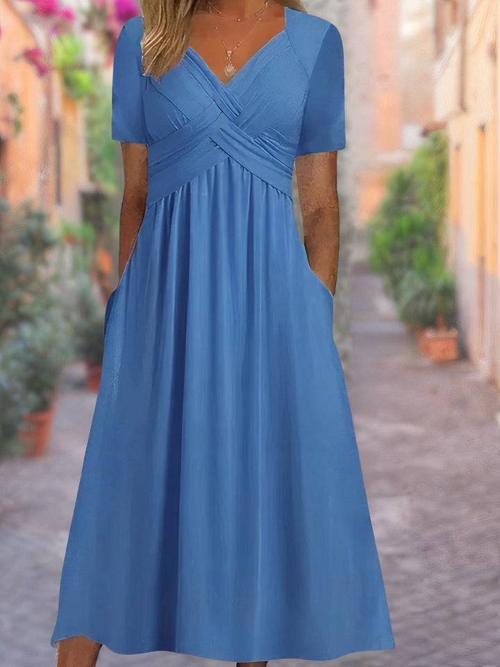 Flattering women's V-neck tummy control dress, designed for comfort and elegant summer fashion. Versatile style.