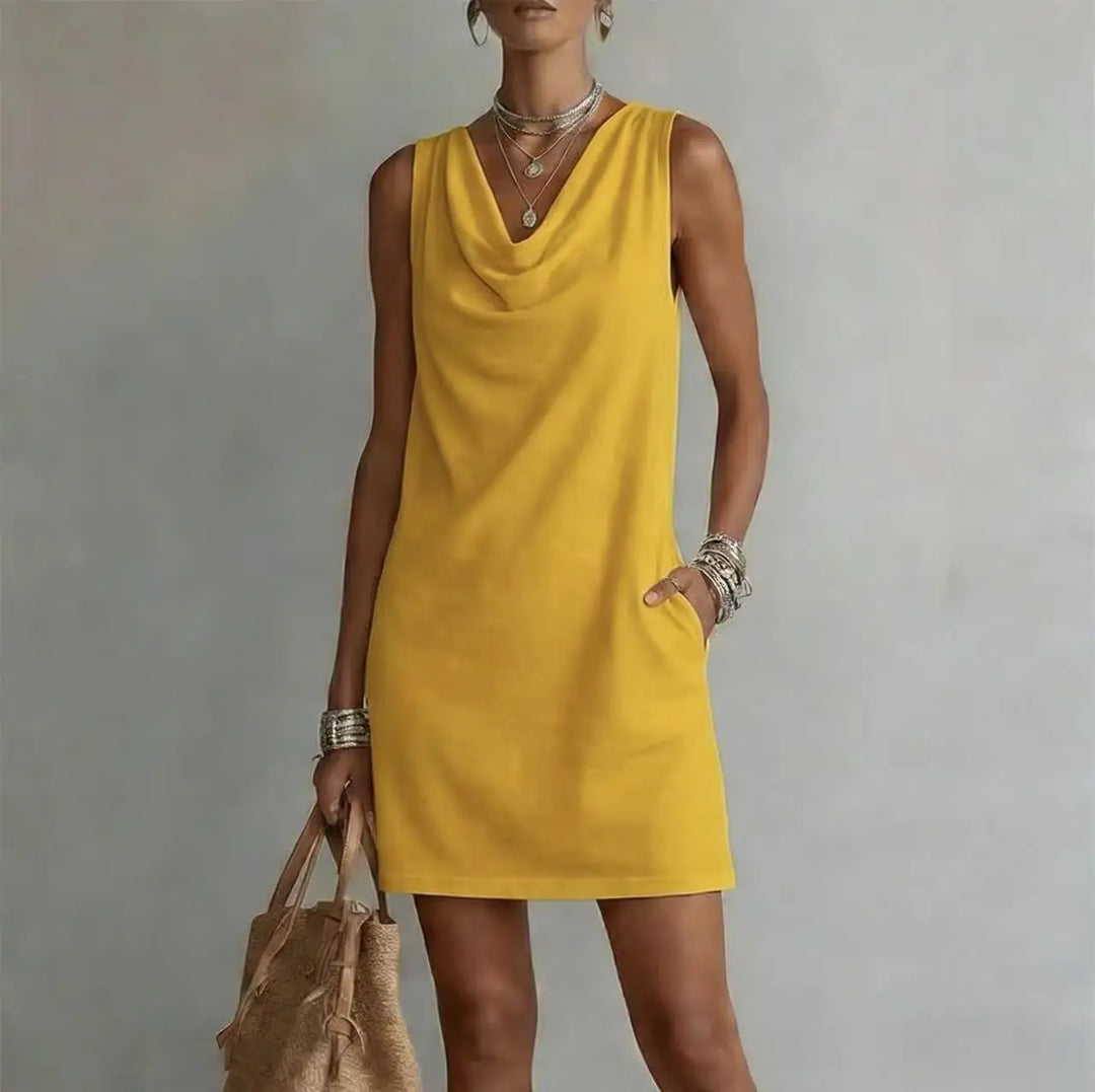 Women's sleeveless cowl neck mini dress, A-line silhouette with practical pockets. Ideal for summer casual wear.