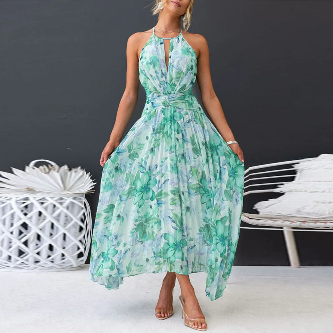 Woman wearing a flowing green boho floral halter maxi dress, ideal for a casual elegant summer vacation.