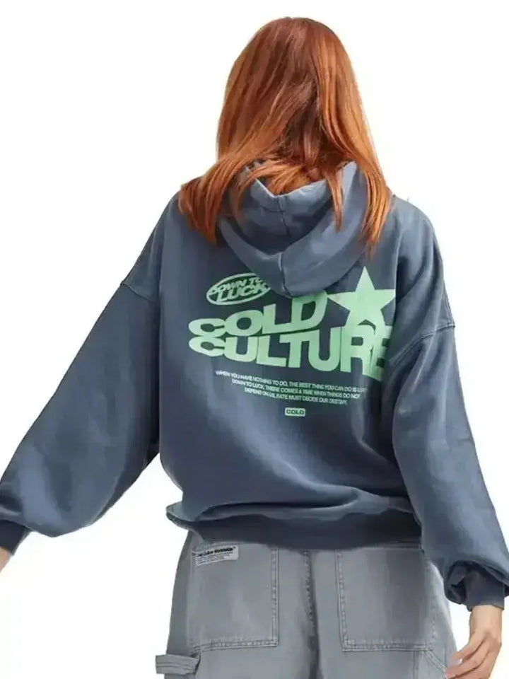 Women's oversized streetwear hoodie with bold graphic print, perfect for casual urban style and relaxed loungewear.