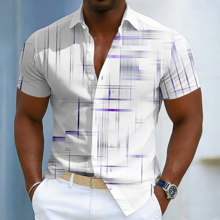 Close-up of the geometric print on a stylish men's short sleeve button-up shirt. Modern summer top detail.