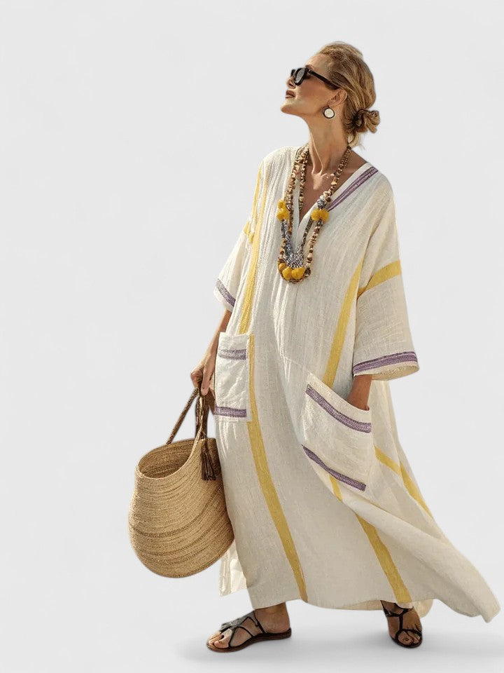 Stylish V-neck striped maxi sundress. Essential kaftan for women's vacation, resort wear, or summer beach days.