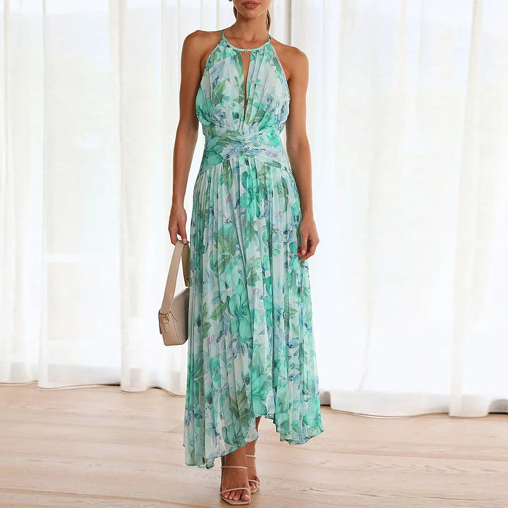 Green floral maxi dress with halterneck for women. Elegant boho summer fashion, great as a casual beach dress.