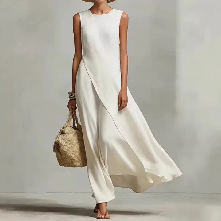 Elegant women's asymmetrical sleeveless maxi dress with a round neck, comfortable & chic for summer.