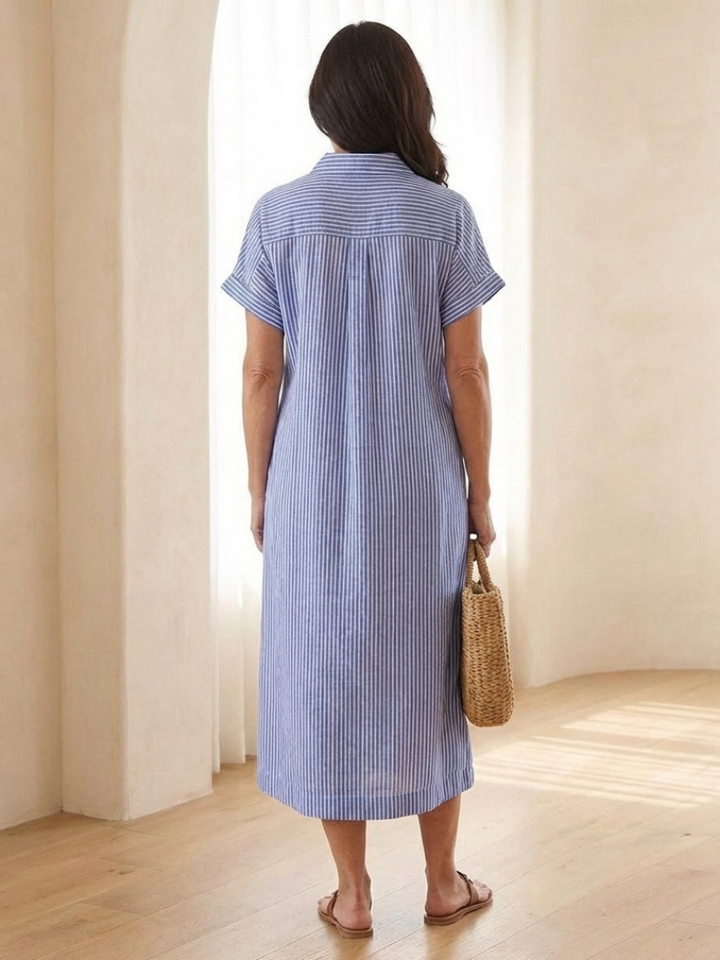 Stylish women's summer midi dress featuring a relaxed fit, colorful stripes, and practical button front.