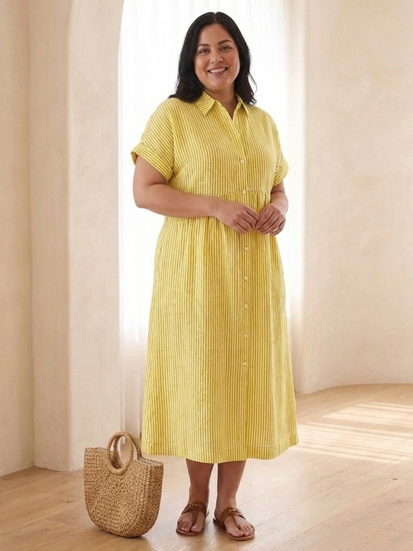 Vibrant women's striped midi dress featuring a button front, short sleeves, & side pockets for comfort.