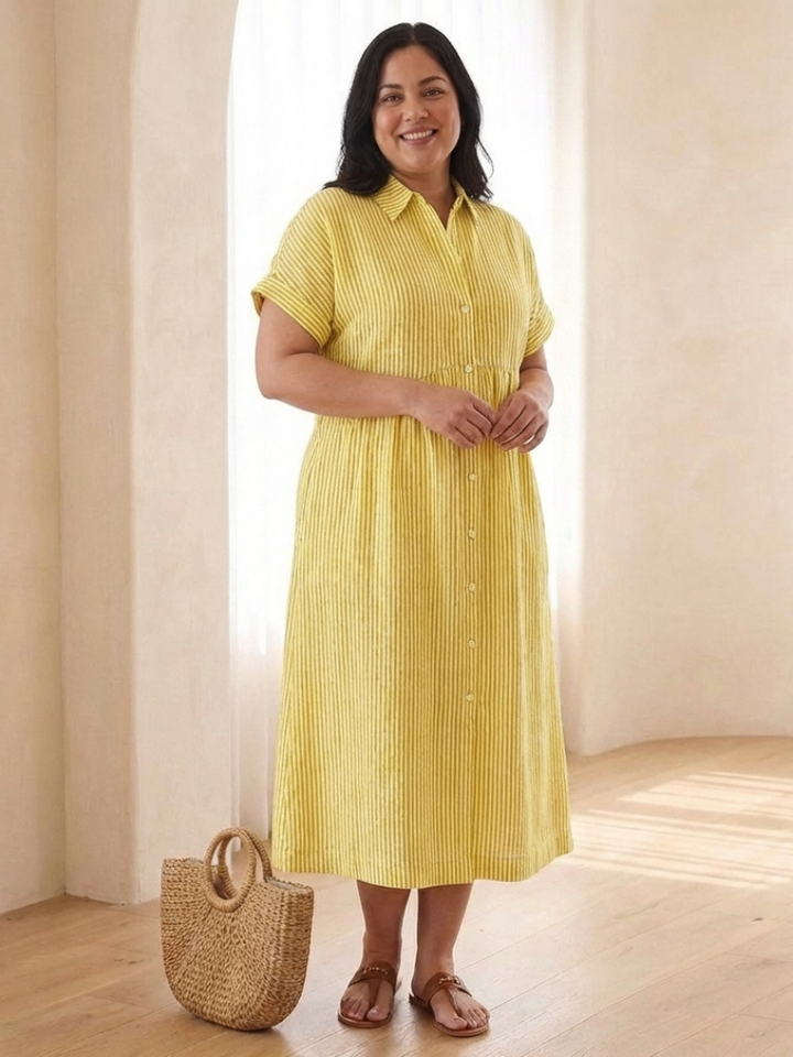 Vibrant women's striped midi dress featuring a button front, short sleeves, & side pockets for comfort.
