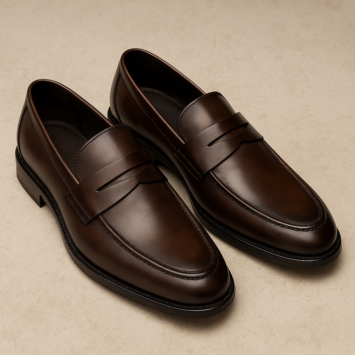 Polished leather men's slip-on penny loafers. Comfortable & versatile classic footwear, ideal for smart casual or dress.