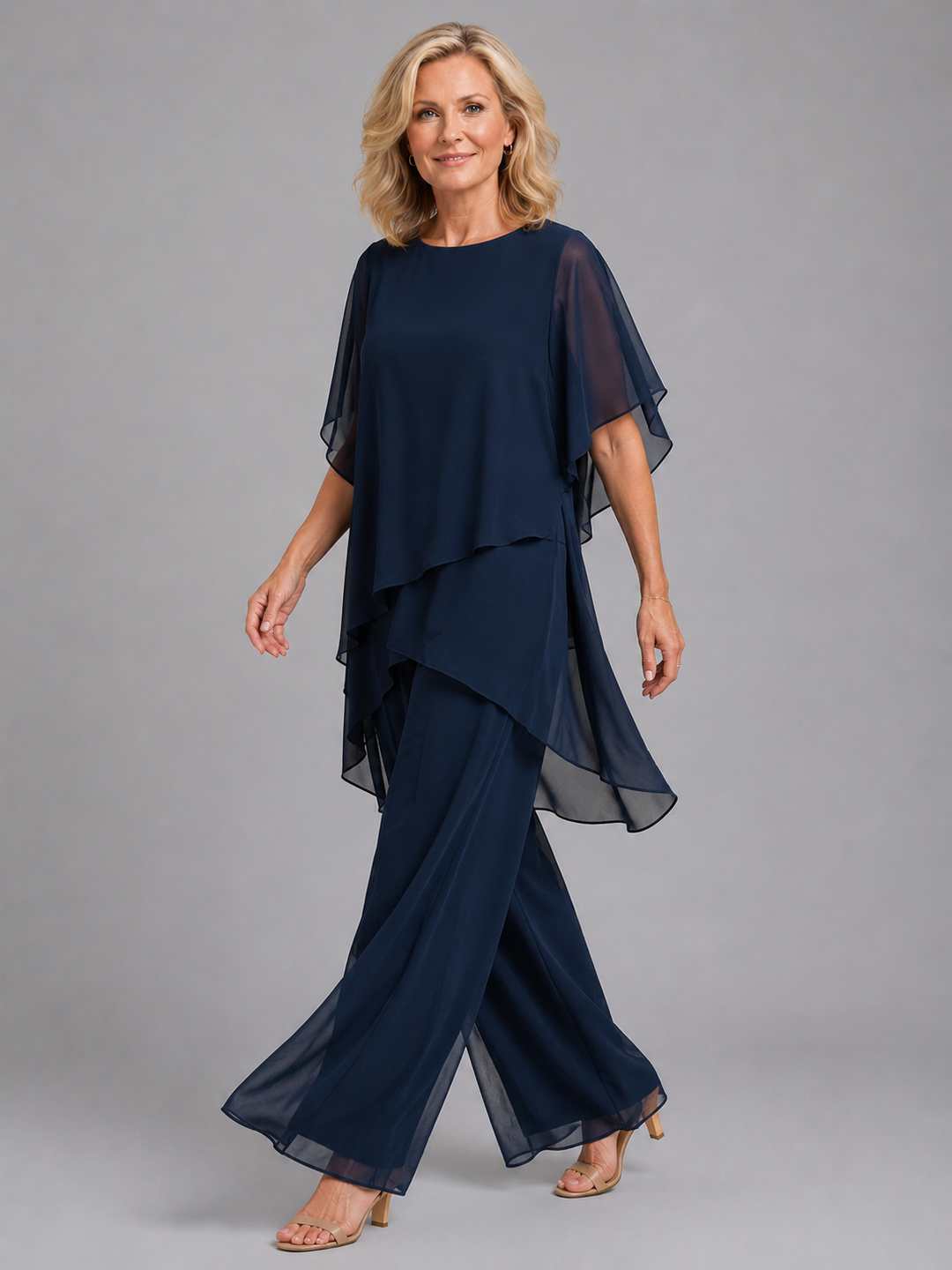 Flowing women's chiffon two-piece outfit featuring wide leg pants and a relaxed flutter sleeve top.