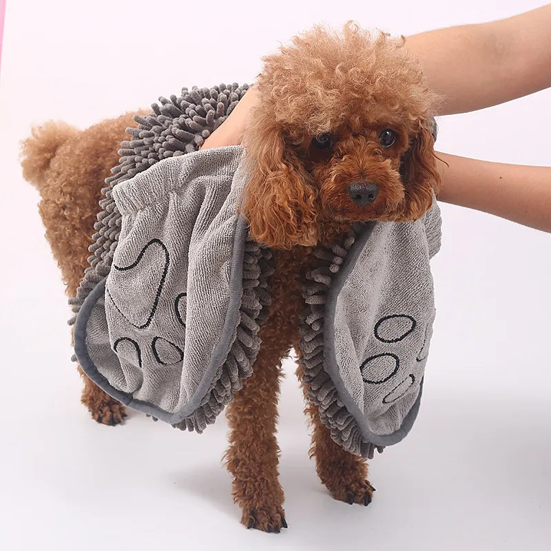 Absorbent microfiber dog drying glove with paw embroidery for easy pet grooming and care.