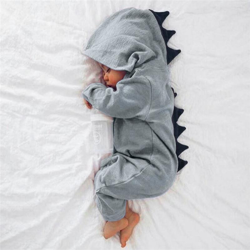 Cute yellow baby dino onesie with fun 3D spikes. Adorable and comfortable infant bodysuit.