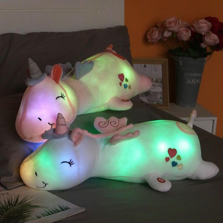 Glowing plush unicorn stuffed animal, a magical comfort toy for kids at night.