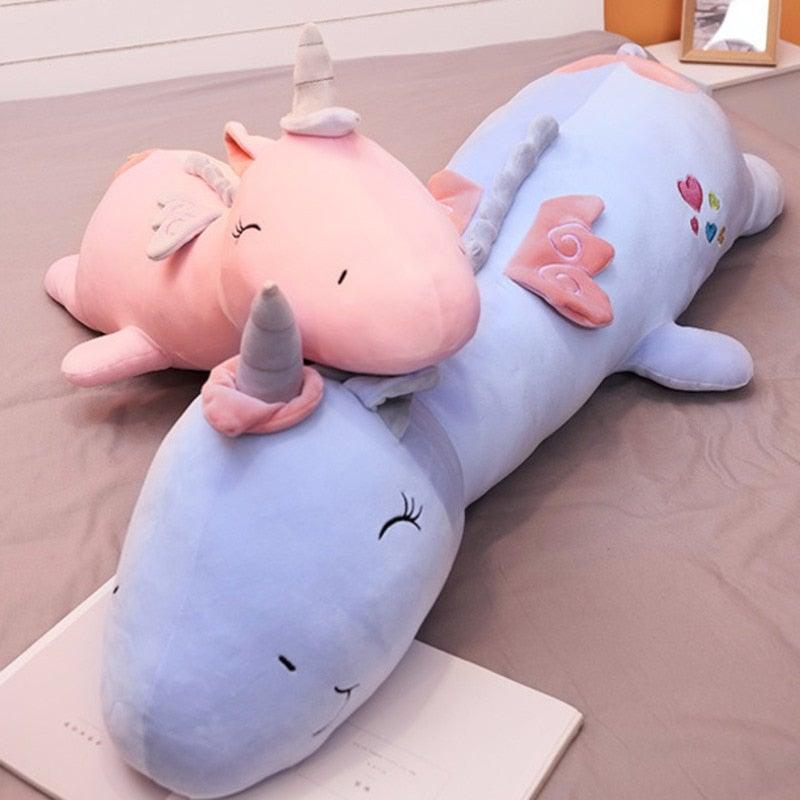 Cute light-up unicorn plush toy sitting upright, ready for magical play and snuggles.