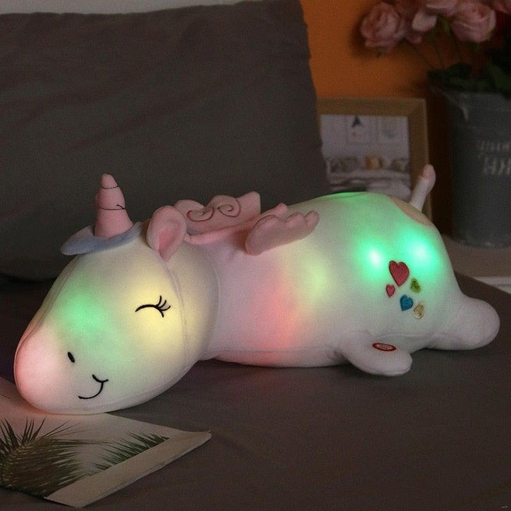 Kids' comfort toy: a soft plush light-up unicorn stuffed animal, perfect for bedtime glowing fun.