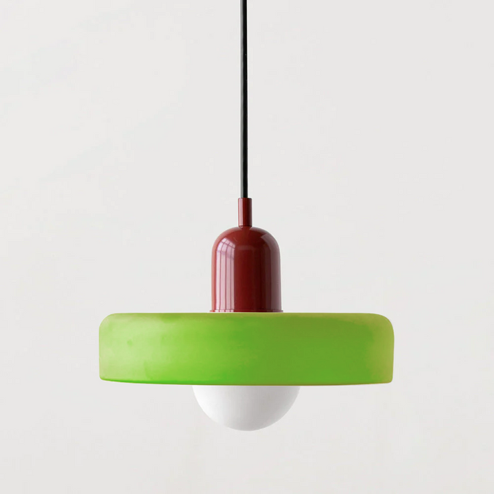 Elegant Bauhaus pendant light, colored glass, warm ambient glow.