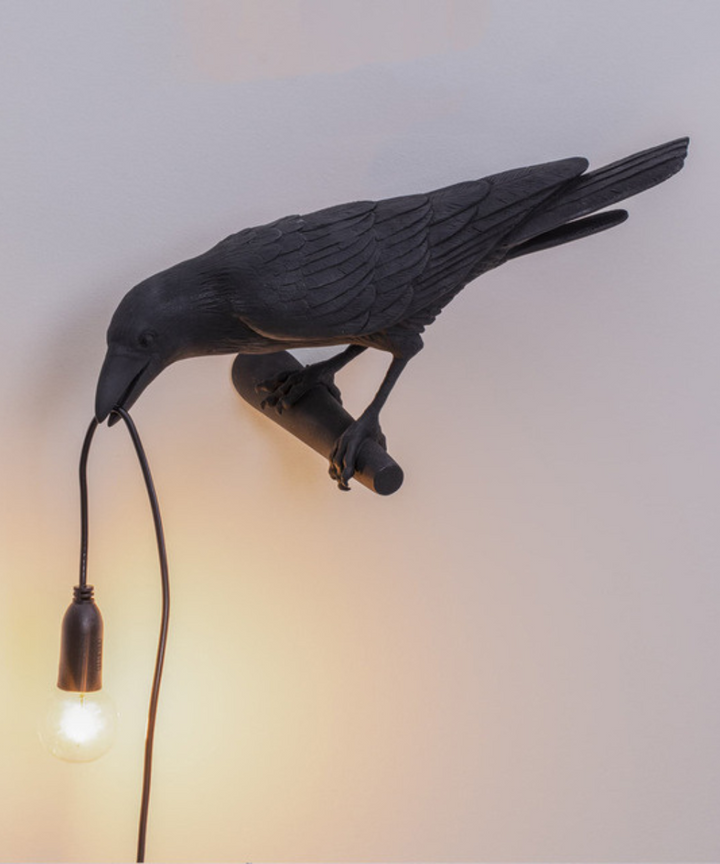 Unique crow lamp with a sculptural black bird design, perfect artistic lighting for any room decor.