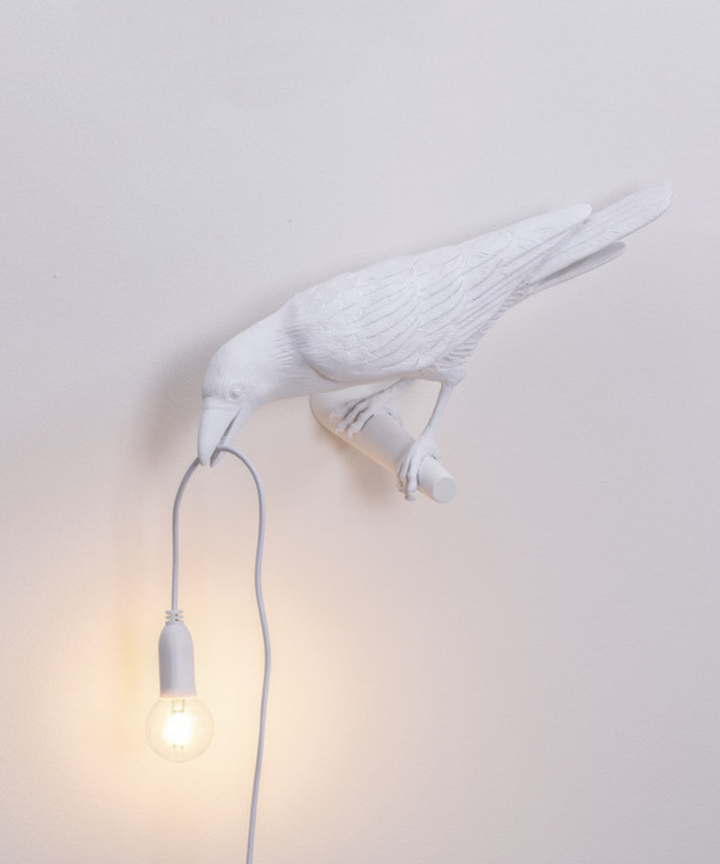 Elegant black crow desk lamp, a unique sculptural light perfect for artistic home or office decor.