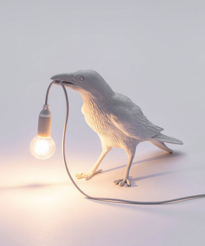 Detailed bird lamp: a black crow table lamp offering artistic lighting and a unique decorative accent.