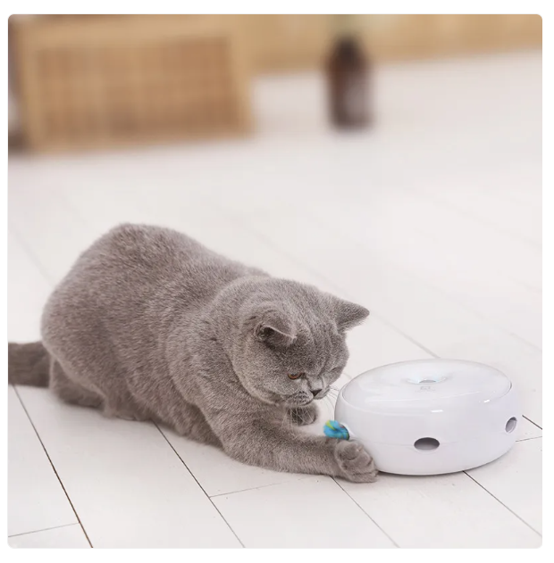 Automatic white cat toy with a vibrant rainbow fluffy feather, encouraging interactive play & hunting instincts.