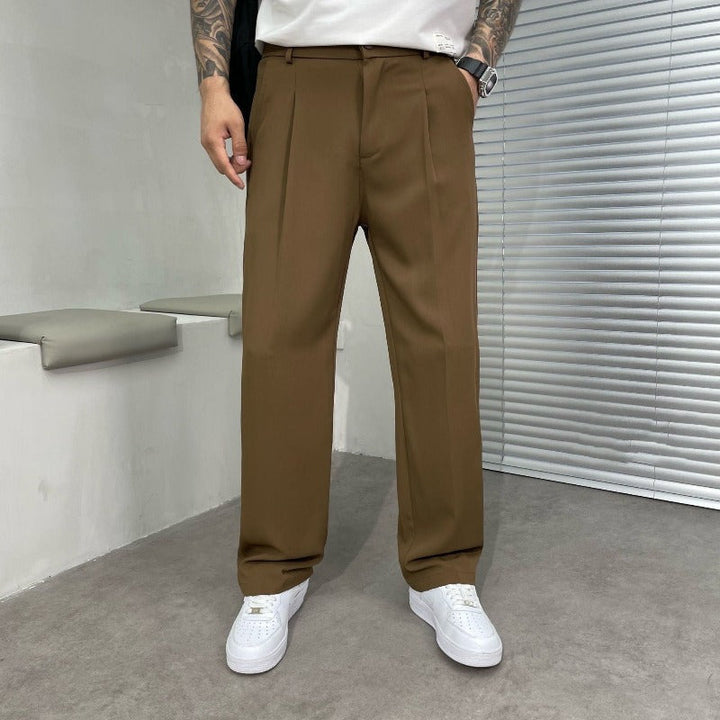 Men's elegant wide-leg dress trousers with double pleats & belt loops for formal or smart casual wear.