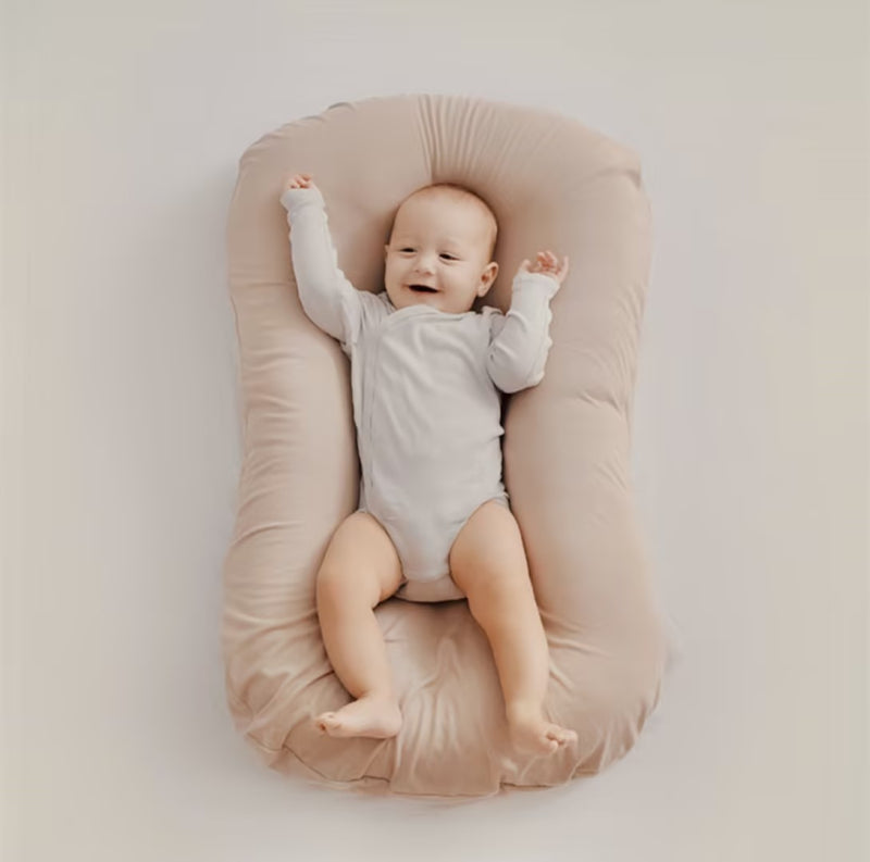 Gentle orthopedic baby support pillow, soft & breathable for infant comfort and nursery decor.