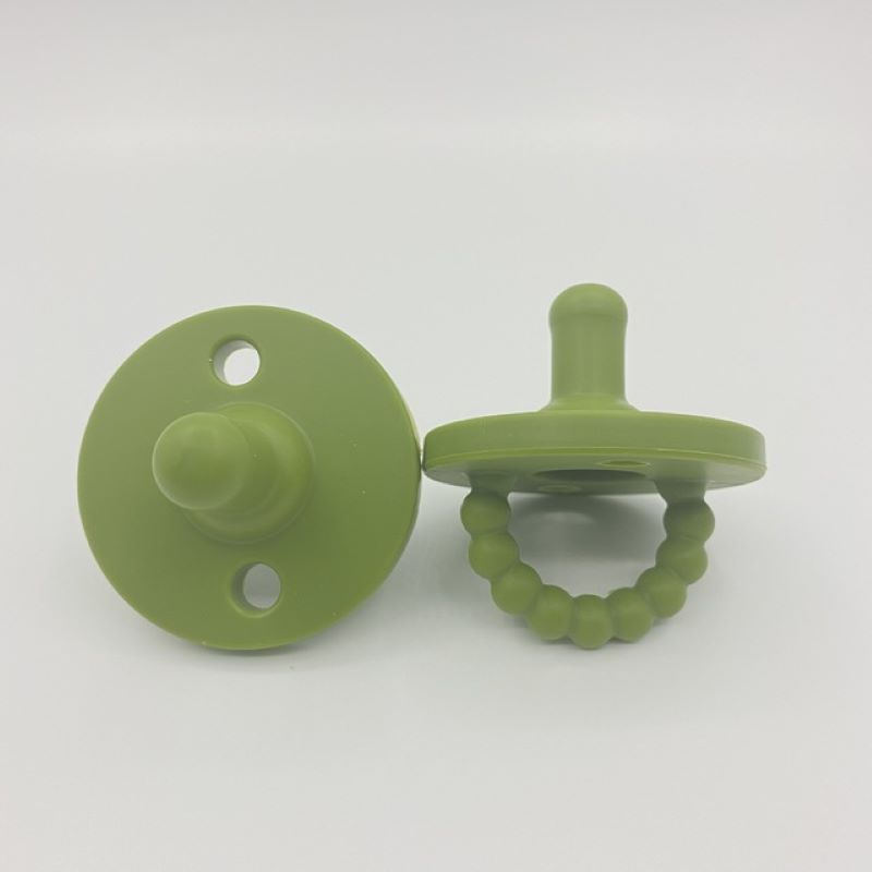 Durable, easy-to-clean silicone baby soother pacifier and teether. Promotes healthy teething for infants.