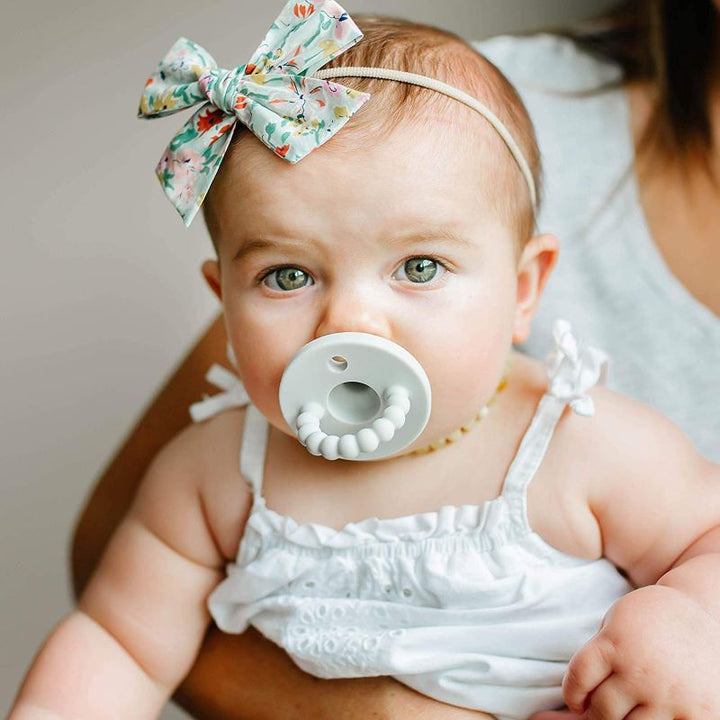 Soft silicone baby pacifier & teether. Ideal for infant comfort, soothing sore gums, and newborn teething.