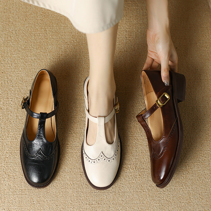 Collection of women's T-Bar Mary Janes in beige, black, and brown, all with elegant brogue details.
