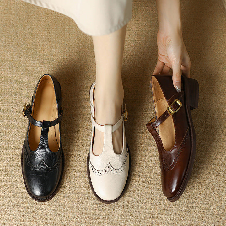 Collection of women's T-Bar Mary Janes in beige, black, and brown, all with elegant brogue details.