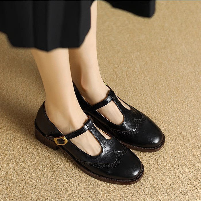 Women's black T-Bar Mary Janes, comfortable block heel with refined brogue design, product CL-0681.