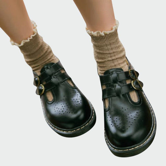 Black classic Mary Jane dress shoes for women, vintage style with buckle strap, comfortable ladies footwear.