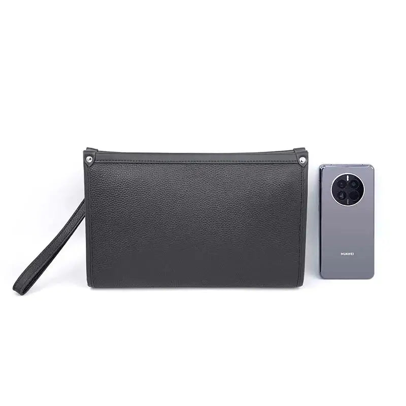 Close-up of men's genuine black leather business clutch, highlighting the premium texture & craftsmanship.